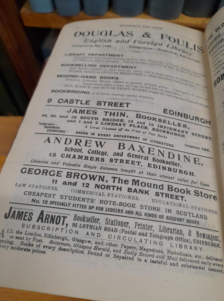 A page of short textual adverts for bookselling businesses in a directory.